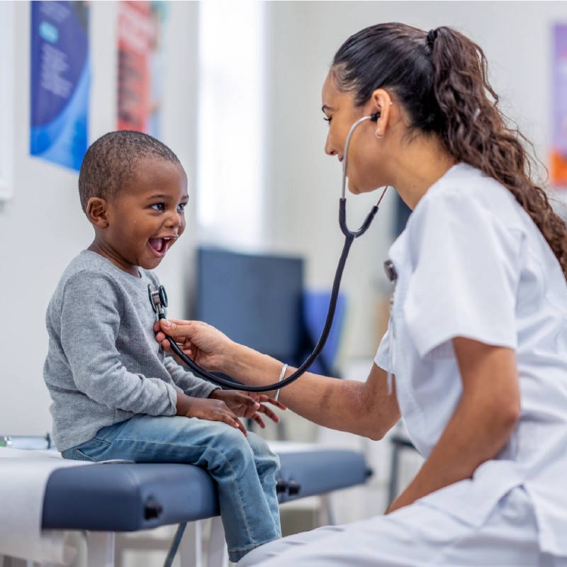 a nurse in a consult with a child in a hospital